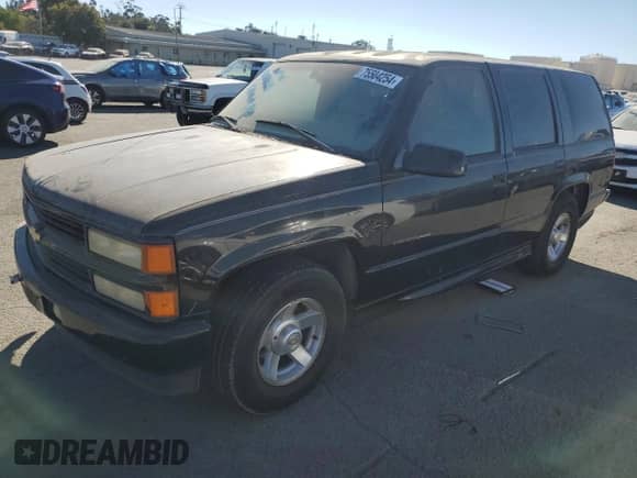 2000 Chevrolet Tahoe Limited z VIN 1GNEC13R7YR221297, wystawiony jako Copart lot #75504254 z przebiegiem 246 714 mil mil oraz Czysty tytuł • Clean title. Historia ofert i sprzedaży dostępna na DreamBid. Obrazek 1.