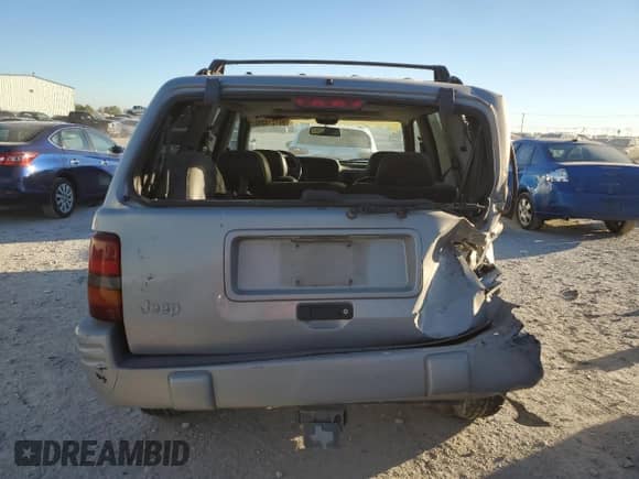 1998 Jeep Grand Cherokee with VIN 1J4FX48S4WC345469, listed as a Copart auction lot 80721224 with 201,543 mi miles and Salvage title. Bid and sale history available at DreamBid. Image 6.