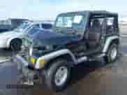 2000 Jeep Wrangler Sport z VIN 1J4FA49S8YP755297, wystawiony jako IAAI lot #42983103 z przebiegiem 181 036 mil mil oraz . Historia ofert i sprzedaży dostępna na DreamBid. Obrazek 2.