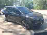 2018 Honda Pilot Elite z VIN 5FNYF6H01JB023279, wystawiony jako IAAI lot #42674476 z przebiegiem 176 598 mil mil oraz . Historia ofert i sprzedaży dostępna na DreamBid. Obrazek 1.