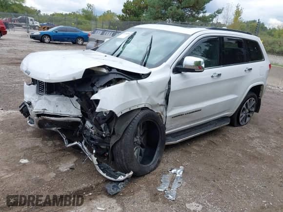 2017 Jeep Grand Cherokee Overland with VIN 1C4RJFCG8HC663780, listed as a IAAI auction lot 43290580 with 105,136 mi miles and . Bid and sale history available at DreamBid. Image 17.