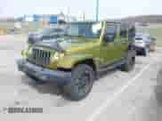 2007 Jeep Wrangler Unlimited Sahara z VIN 1J8GA59167L161894, wystawiony jako IAAI lot #41856064 z przebiegiem 122 714 mil mil oraz . Historia ofert i sprzedaży dostępna na DreamBid. Obrazek 18.