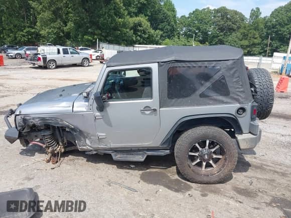 2013 Jeep Wrangler Sport with VIN 1C4AJWAG4DL693286, listed as a IAAI auction lot 42816812 with 135,758 mi miles and . Bid and sale history available at DreamBid. Image 14.