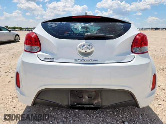 2014 Hyundai Veloster z VIN KMHTC6ADXEU211730, wystawiony jako Copart lot #71236595 z przebiegiem 107 121 mil mil oraz Szkoda całkowita • Salvage title. Historia ofert i sprzedaży dostępna na DreamBid. Obrazek 6.