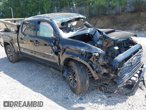 2021 Toyota Tacoma SR5 z VIN 3TYDZ5BN1MT002778, wystawiony jako IAAI lot #42591088 z przebiegiem Nie podano mil oraz . Historia ofert i sprzedaży dostępna na DreamBid. Obrazek 1.