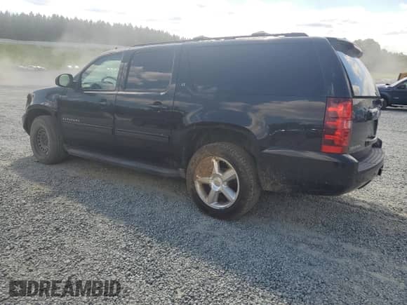 2012 Chevrolet Suburban LT with VIN 1GNSCJE00CR101481, listed as a Copart auction lot 69094655 with 174,206 mi miles and Salvage title. Bid and sale history available at DreamBid. Image 2.