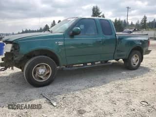 2000 Ford F-150 XL with VIN 1FTRX08L6YKB38689, listed as a Copart auction lot 62032265 with 330,746 mi miles and Salvage title. Bid and sale history available at DreamBid. Image 1.