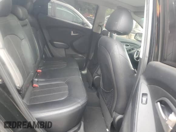 2012 Hyundai Tucson GLS with VIN KM8JUCAC8CU542913, listed as a Copart auction lot 70823765 with 124,426 mi miles and Salvage title. Bid and sale history available at DreamBid. Image 11.