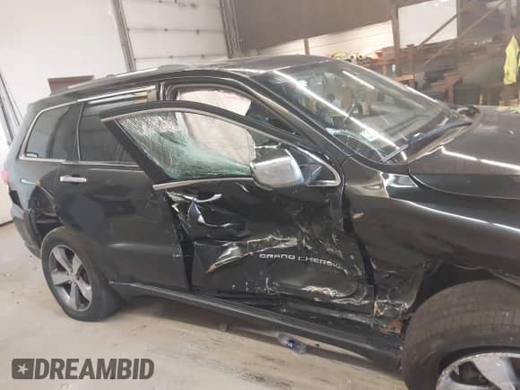 2014 Jeep Grand Cherokee Limited z VIN 1C4RJFBG2EC588717, wystawiony jako IAAI lot #42707543 z przebiegiem 185 070 mil mil oraz . Historia ofert i sprzedaży dostępna na DreamBid. Obrazek 13.