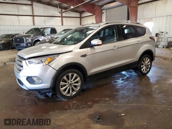 2017 Ford Escape Titanium with VIN 1FMCU9JD1HUA79587, listed as a Copart auction lot 84209285 with 61,058 mi miles and Clean title. Bid and sale history available at DreamBid. Image 1.