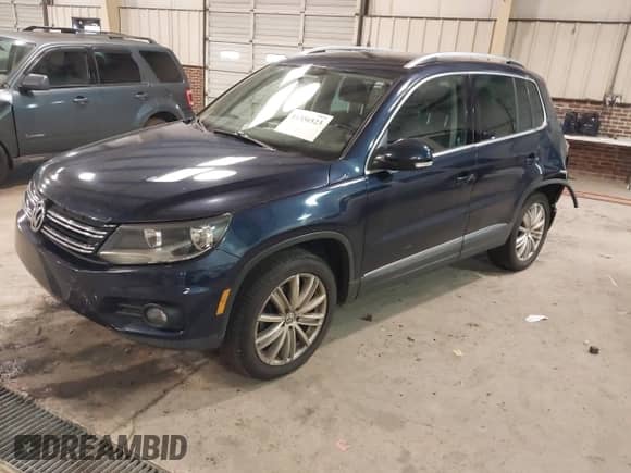2014 Volkswagen Tiguan SEL with VIN WVGAV3AX8EW563008, listed as a IAAI auction lot 41356523 with 138,211 mi miles and . Bid and sale history available at DreamBid. Image 2.