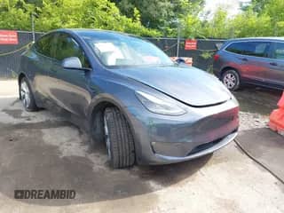 2023 Tesla Model Y Long Range with VIN 7SAYGAEE8PF880355, listed as a IAAI auction lot 42635761 with 57,442 mi miles and . Bid and sale history available at DreamBid. Image 1.