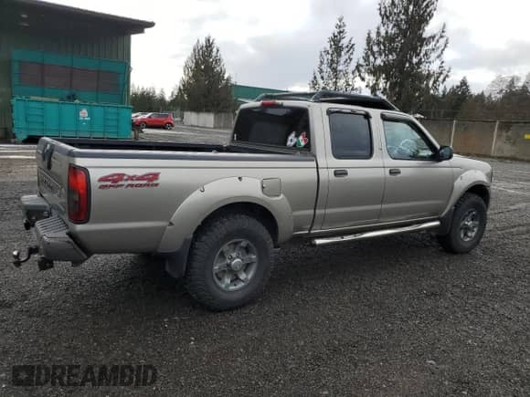 2003 Nissan Frontier XE with VIN 1N6ED29Y43C414977, listed as a Copart auction lot 43938595 with 212,303 mi miles and Salvage title. Bid and sale history available at DreamBid. Image 3.