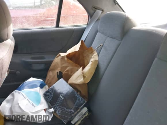 2005 Hyundai Accent GLS z VIN KMHCG45C65U607423, wystawiony jako IAAI lot #42142929 z przebiegiem 181 516 mil mil oraz . Historia ofert i sprzedaży dostępna na DreamBid. Obrazek 8.