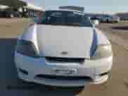 2006 Hyundai Tiburon GT z VIN KMHHN65F46U191990, wystawiony jako Copart lot #61887894 z przebiegiem 252 384 mil mil oraz Szkoda całkowita • Salvage title. Historia ofert i sprzedaży dostępna na DreamBid. Obrazek 5.