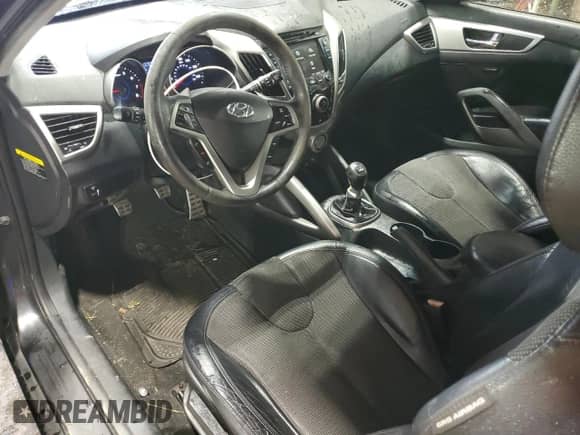 2012 Hyundai Veloster w/Black Int z VIN KMHTC6AD5CU020715, wystawiony jako Copart lot #87423735 z przebiegiem 137 931 mil mil oraz Szkoda całkowita • Salvage title. Historia ofert i sprzedaży dostępna na DreamBid. Obrazek 8.