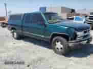 1998 Chevrolet Silverado 1500 z VIN 2GCEK19R0W1158312, wystawiony jako Copart lot #68561985 z przebiegiem 196 500 mil mil oraz Szkoda całkowita • Salvage title. Historia ofert i sprzedaży dostępna na DreamBid. Obrazek 4.