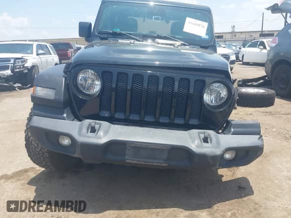 2019 Jeep Wrangler Sport S with VIN 1C4GJXAG0KW679915, listed as a IAAI auction lot 42420876 with 77,169 mi miles and . Bid and sale history available at DreamBid. Image 12.