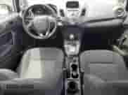 2014 Ford Fiesta S z VIN 3FADP4AJ6EM131441, wystawiony jako Copart lot #64676975 z przebiegiem 52 942 mil mil oraz Czysty tytuł • Clean title. Historia ofert i sprzedaży dostępna na DreamBid. Obrazek 8.