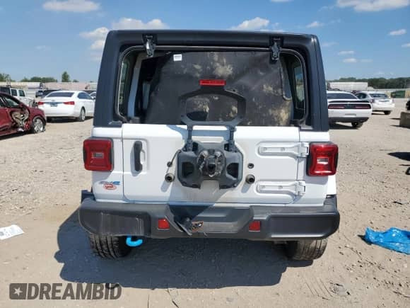 2023 Jeep Wrangler Sahara with VIN 1C4JJXP69PW555542, listed as a Copart auction lot 70154975 with 38,720 mi miles and Salvage title. Bid and sale history available at DreamBid. Image 6.