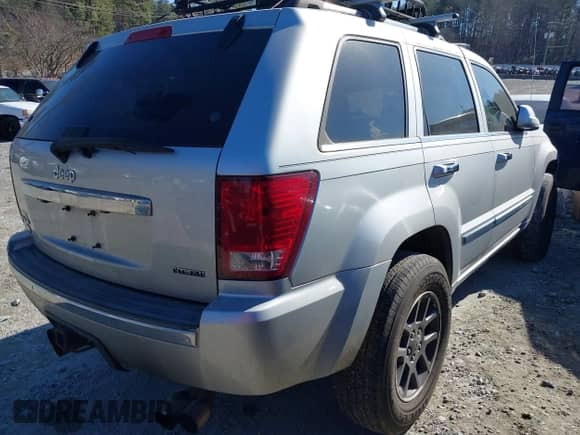 2009 Jeep Grand Cherokee with VIN 1J8HR68T39C540795, listed as a IAAI auction lot 41379112 with 236,624 mi miles and . Bid and sale history available at DreamBid. Image 4.