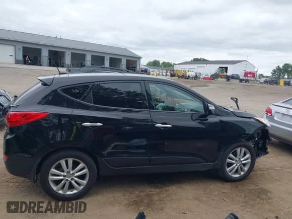 2012 Hyundai Tucson GLS with VIN KM8JU3ACXCU519889, listed as a IAAI auction lot 43041175 with 157,398 mi miles and . Bid and sale history available at DreamBid. Image 13.