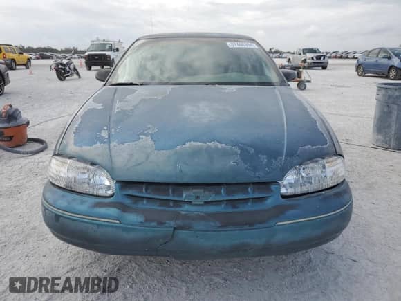 1997 Chevrolet Lumina LS with VIN 2G1WL52M1V9120300, listed as a Copart auction lot 87460394 with 142,588 mi miles and Salvage title. Bid and sale history available at DreamBid. Image 5.