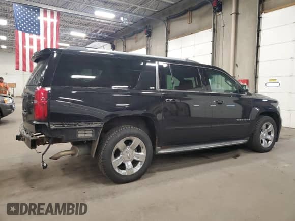 2015 Chevrolet Suburban LTZ с VIN 1GNSKKKC8FR120677, выставлен на аукционе Copart как лот 86426505 с пробегом 156 320 миль миль и Списание • Salvage title. История ставок и продаж доступна на DreamBid. Изображение 3.