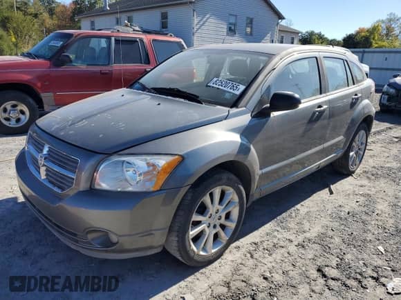 2011 Dodge Caliber Heat with VIN 1B3CB5HA7BD231380, listed as a Copart auction lot 82520765 with 217,144 mi miles and Clean title. Bid and sale history available at DreamBid. Image 1.