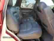 2002 Cadillac Escalade z VIN 1GYEC63T62R106614, wystawiony jako Copart lot #64429175 z przebiegiem 172 368 mil mil oraz Czysty tytuł • Clean title. Historia ofert i sprzedaży dostępna na DreamBid. Obrazek 11.