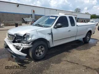 2003 Ford F-150 XL with VIN 2FTRX17LX3CB02394, listed as a Copart auction lot 68928305 with 261,073 mi miles and Salvage title. Bid and sale history available at DreamBid. Image 1.