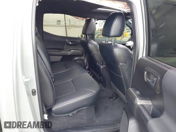 2023 Toyota Tacoma SR z VIN 3TMCZ5ANXPM631484, wystawiony jako IAAI lot #43316224 z przebiegiem 31 823 mil mil oraz . Historia ofert i sprzedaży dostępna na DreamBid. Obrazek 8.