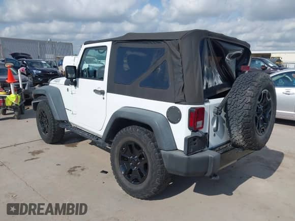 2015 Jeep Wrangler Willys Wheeler with VIN 1C4AJWAG0FL562536, listed as a IAAI auction lot 42384747 with 103,507 mi miles and . Bid and sale history available at DreamBid. Image 3.