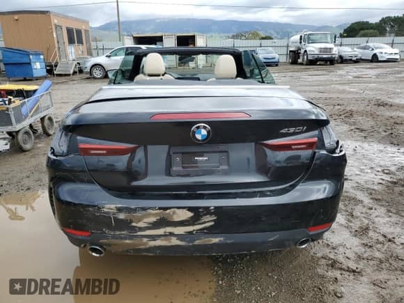 2022 BMW 4 Series 430i with VIN WBA23AT03NCJ32884, listed as a Copart auction lot 48077065 with 12,910 mi miles and Salvage title. Bid and sale history available at DreamBid. Image 6.