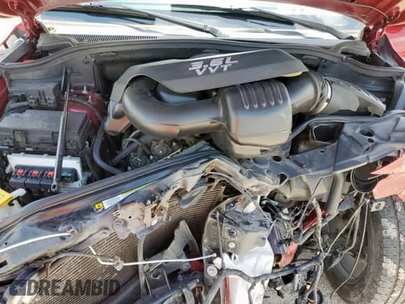 2012 Jeep Grand Cherokee Overland with VIN 1C4RJECG9CC136950, listed as a Copart auction lot 61463225 with 84,983 mi miles and Salvage title. Bid and sale history available at DreamBid. Image 12.