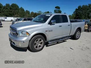 2014 Ram 1500 Laramie with VIN 1C6RR7JT1ES266497, listed as a Copart auction lot 84878445 with 95,194 mi miles and Salvage title. Bid and sale history available at DreamBid. Image 1.