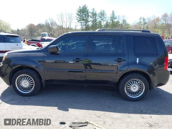 2013 Honda Pilot EX-L with VIN 5FNYF4H75DB002151, listed as a IAAI auction lot 42141451 with 223,651 mi miles and . Bid and sale history available at DreamBid. Image 14.