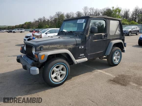 2003 Jeep Wrangler X z VIN 1J4FA39S23P359983, wystawiony jako Copart lot #59469005 z przebiegiem 118 585 mil mil oraz Czysty tytuł • Clean title. Historia ofert i sprzedaży dostępna na DreamBid. Obrazek 1.