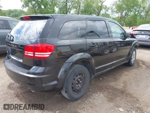 2012 Dodge Journey SE z VIN 3C4PDCAB9CT290198, wystawiony jako IAAI lot #42254160 z przebiegiem 91 000 mil mil oraz . Historia ofert i sprzedaży dostępna na DreamBid. Obrazek 4.