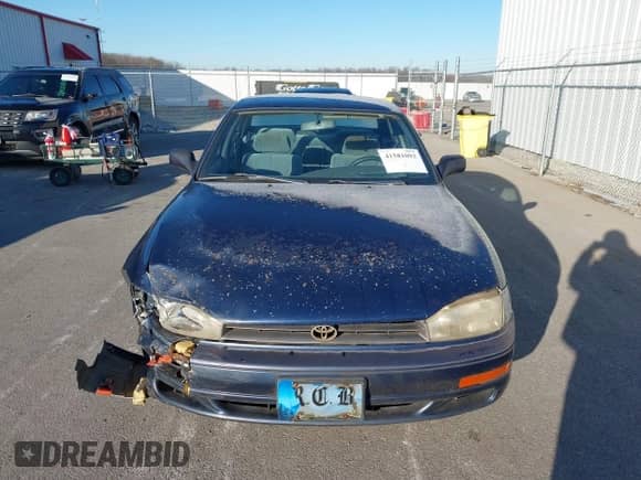 1994 Toyota Camry LE z VIN 4T1SK12EXRU374215, wystawiony jako IAAI lot #41581093 z przebiegiem 80 397 mil mil oraz . Historia ofert i sprzedaży dostępna na DreamBid. Obrazek 12.
