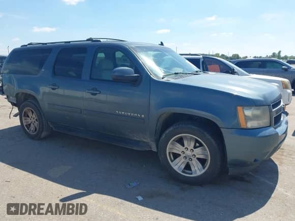 2009 Chevrolet Suburban 1LT z VIN 1GNFC26019J107903, wystawiony jako IAAI lot #43309738 z przebiegiem 228 930 mil mil oraz . Historia ofert i sprzedaży dostępna na DreamBid. Obrazek 1.