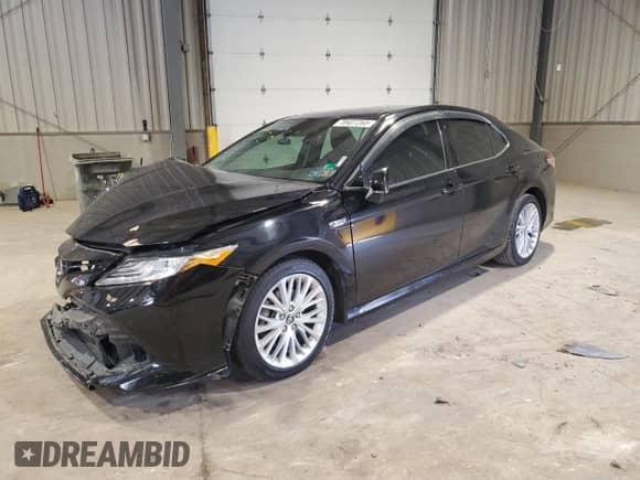 2019 Toyota Camry Hybrid LE z VIN 4T1B21HK7KU515521, wystawiony jako Copart lot #70407265 z przebiegiem 200 945 mil mil oraz Szkoda całkowita • Salvage title. Historia ofert i sprzedaży dostępna na DreamBid. Obrazek 1.