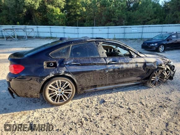 2015 BMW 4 Series 428i with VIN WBA4A5C5XFGK15854, listed as a Copart auction lot 82477925 with 69,170 mi miles and Clean title. Bid and sale history available at DreamBid. Image 3.