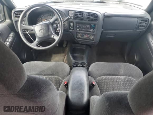 1999 Chevrolet Blazer LS z VIN 1GNDT13W7X2168500, wystawiony jako Copart lot #70659475 z przebiegiem 130 002 mil mil oraz Szkoda całkowita • Salvage title. Historia ofert i sprzedaży dostępna na DreamBid. Obrazek 8.