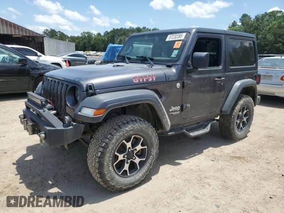 2020 Jeep Wrangler Sport S with VIN 1C4GJXAG8LW312195, listed as a Copart auction lot 57232285 with 102,233 mi miles and Salvage title. Bid and sale history available at DreamBid. Image 1.