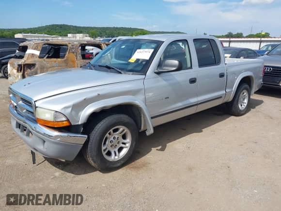 2002 Dodge Dakota SLT с VIN 1B7HL48X22S507864, выставлен на аукционе IAAI как лот 42637974 с пробегом 131 914 миль миль и . История ставок и продаж доступна на DreamBid. Изображение 2.