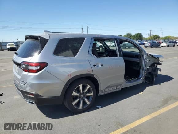 2024 Honda Pilot Touring with VIN 5FNYG1H73RB036382, listed as a Copart auction lot 69703235 with 30,329 mi miles and Salvage title. Bid and sale history available at DreamBid. Image 3.