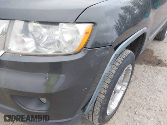 2011 Jeep Grand Cherokee 70th Anniversary with VIN 1J4RR4GG3BC582470, listed as a IAAI auction lot 42138291 with 241,429 mi miles and . Bid and sale history available at DreamBid. Image 6.