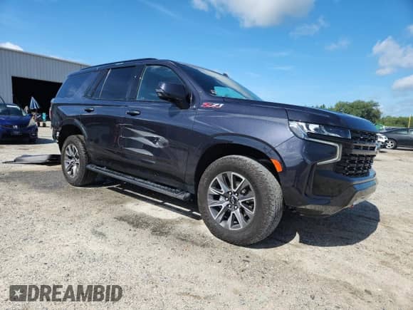 2024 Chevrolet Tahoe Z71 with VIN 1GNSKPKDXRR390701, listed as a Copart auction lot 64252615 with 20,815 mi miles and Salvage title. Bid and sale history available at DreamBid. Image 4.