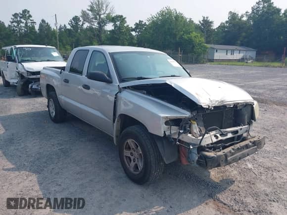 2006 Dodge Dakota SLT with VIN 1D7HE48K96S533601, listed as a IAAI auction lot 42409723 with 128,591 mi miles and . Bid and sale history available at DreamBid. Image 1.